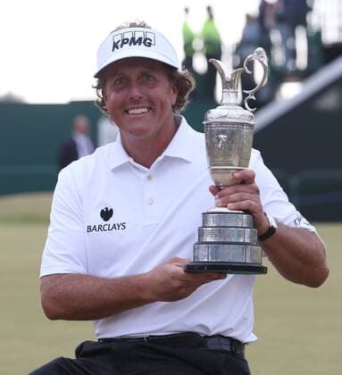 USA s Phil Mickelson holds the Claret Jug after winning the Open Championship at Muirfield on the fourth day of the 2013 Open Championship in Muirfield, Scotland on July 21 , 2013.Mickelson won with a score of three under par.  LON2013072101