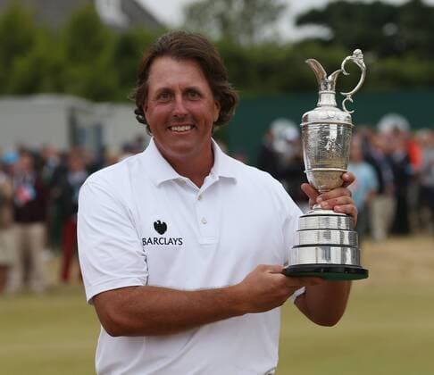 USA s Phil Mickelson holds the Claret Jug after winning the Open Championship at Muirfield on the fourth day of the 2013 Open Championship in Muirfield, Scotland on July 21 , 2013.Mickelson won with a score of three under par.  LON2013072106
