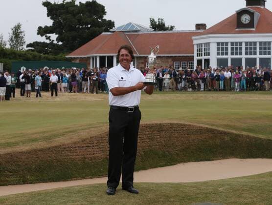 USA s Phil Mickelson holds the Claret Jug after winning the Open Championship at Muirfield on the fourth day of the 2013 Open Championship in Muirfield, Scotland on July 21 , 2013.Mickelson won with a score of three under par.  LON2013072103