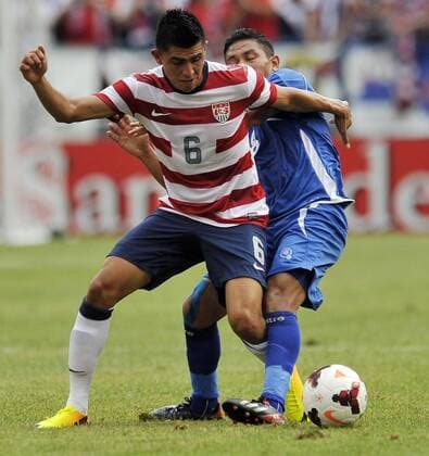 July 21, 2013 - Baltimore, MD, USA - U.S. s Joe Corona tangles with El Salvador s Osael Romero Castillo during the first half of the Gold Cup quarterfinals in Baltimore, Maryland, Sunday, July 21, 2013. U.S. wins, 5-1. El Salvador vs. USA - ZUMAm67