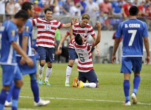 July 21, 2013 - Baltimore, MD, USA - U.S. players Michael Parkhurst, from left, and Clarence Goodson congratulate Joe Corona on his goal against the El Salvador during the first half of the Gold Cup quarterfinals in Baltimore, Maryland, Sunday, July 21, 2013. U.S. wins, 5-1. El Salvador vs. USA - ZUMAm67