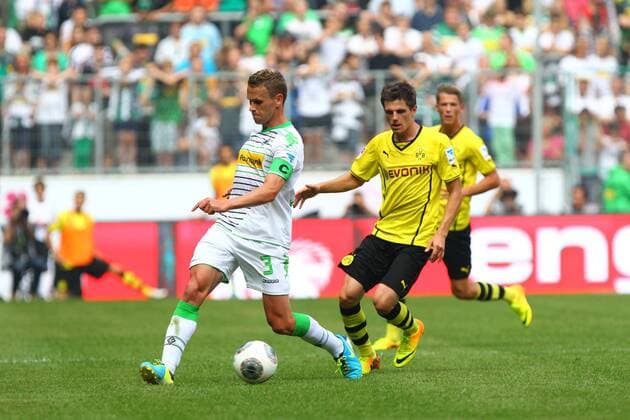 Kapitaen Filip DAEMS 3 (Borussia Moenchengladbach) gegen Jonas HOFMANN 7 (Borussia Dortmund), Zweikampf, Aktion, Action quer, querformat, landscape, horizontal Borussia Moenchengladbach vs Borussia Dortmund --- Fussball --- Telekom Cup 2013 --- 20.07.2013 EP_JSE