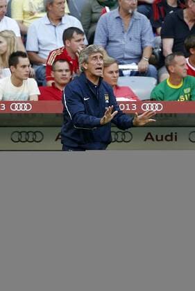 Manchester City s Manuel Pellegrini looks on AC Milan v Manchester City - Audi Cup - Allianz Arena - Munich - Germany -31 07 2013 - Pic David Klein Sportimage EDITORIAL USE ONLY. No use with unauthorised audio, video, data, fixture lists, club league logos or live services. Online in-match use limited to 120 images, no video emulation. No use in betting, games or single club league player publications.
