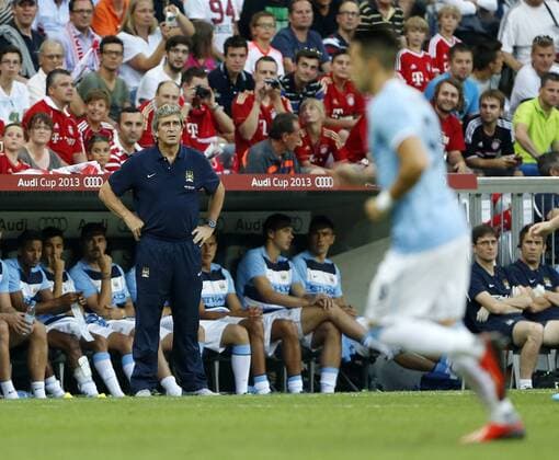 Manchester City s Manuel Pellegrini looks on Bayern Munich v Manchester City - Audi Cup - Allianz Arena - Munich - Germany -01 08 2013 - Pic David Klein Sportimage EDITORIAL USE ONLY. No use with unauthorised audio, video, data, fixture lists, club league logos or live services. Online in-match use limited to 120 images, no video emulation. No use in betting, games or single club league player publications.