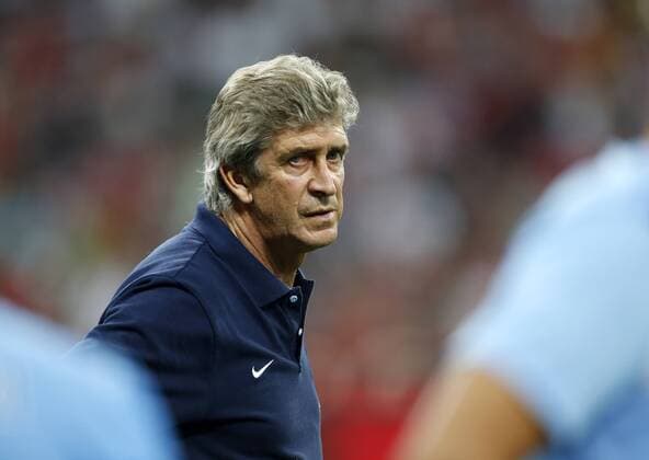 Manchester City s Manuel Pellegrini looks on dejecetd at the final whistle Bayern Munich v Manchester City - Audi Cup - Allianz Arena - Munich - Germany -01 08 2013 - Pic David Klein Sportimage EDITORIAL USE ONLY. No use with unauthorised audio, video, data, fixture lists, club league logos or live services. Online in-match use limited to 120 images, no video emulation. No use in betting, games or single club league player publications.