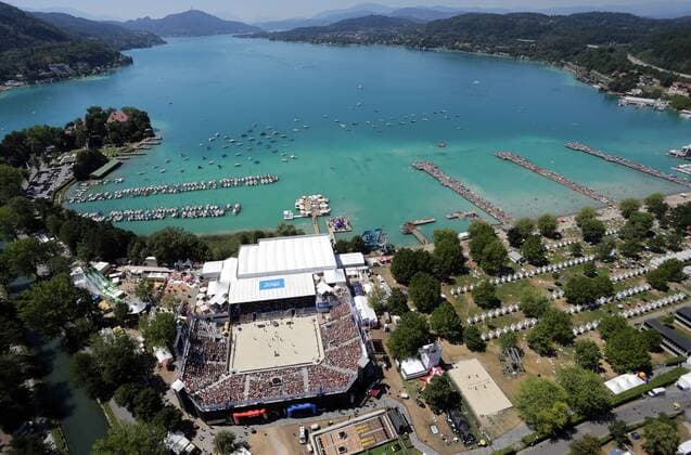 BEACHVOLLEYBALL - CEV EM 2013 KLAGENFURT,AUSTRIA,02.AUG.13 - DIVERS, BEACHVOLLEYBALL - CEV Europameisterschaft, Checkrobin-Hubschrauberflug. Bild zeigt das Stadion am Wörthersee. Keywords: Luftaufnahme. 