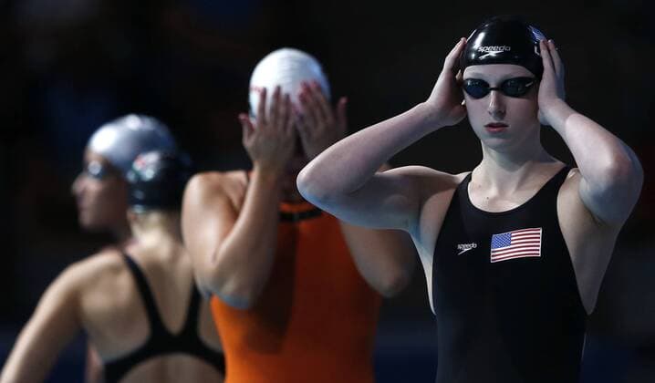 Katie Ledecky (R) of the United States reacts before the women s 800m freestyle final of the swimming competition of the 15th FINA World Championships at Palau Sant Jordi in Barcelona, Spain on Aug. 3, 2013. Katie Ledecky took the gold medal with a new world record of 8:13.86. (Xinhua Wang Lili) (SP)SPAIN-BARCELONA-FINA WORLD CHAMPIONSHIPS-SWIMMING 
