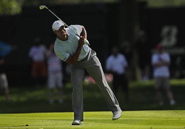 Aug. 3, 2013 - Akron, OH, USA - Tiger Woods follows the flight of his second shot from the fairway on the 13th hole during the third round of the WGC-Bridgestone Invitational at Firestone Country Club in Akron, Ohio, on Saturday, August 3, 2013. Woods carries a seven-shot lead heading into the final round. WGC-Bridgestone Invitational - ZUMAm67