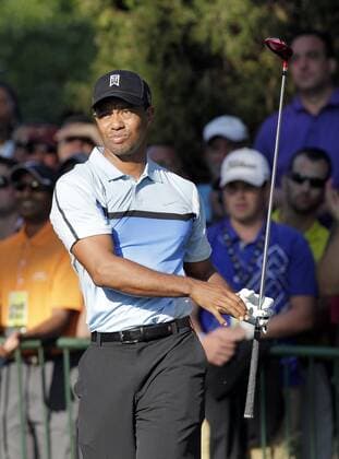 Tiger Woods hits his tee shot on hole 10 in the first round of the PGA Golf Herren Championship at Oak Hill Country Club in Rochester, New York on August 8, 2013.  NYP20130808102