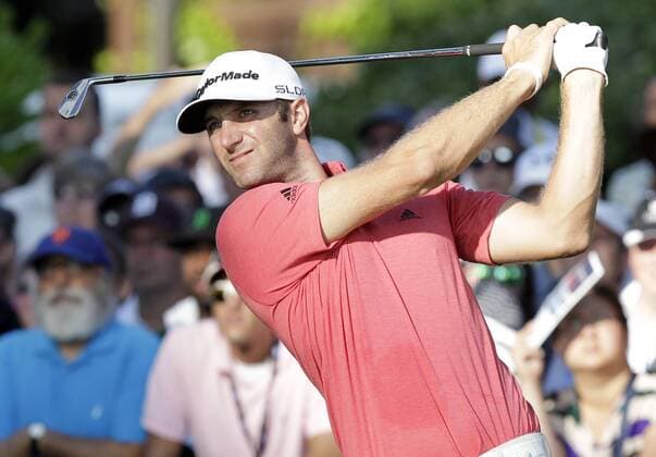 Dustin Johnson hits his tee shot on hole 10 in the first round of the PGA Golf Herren Championship at Oak Hill Country Club in Rochester, New York on August 8, 2013.  NYP20130808108