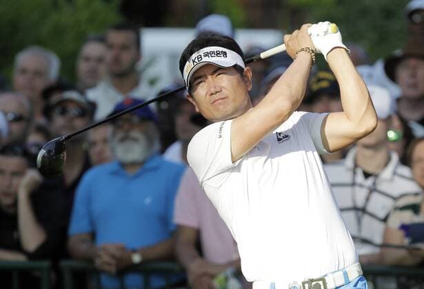 Y.E. Yang hits his tee shot on hole 10 in the first round of the PGA Golf Herren Championship at Oak Hill Country Club in Rochester, New York on August 8, 2013.  NYP20130808111