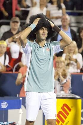 Aug. 08, 2013 - Montreal, Quebec, CAN - Novak Djokovic (SRB) wins his evening match during day 4 action and celebrates with a large wig and some dancing on centre court. Tennis 2013 - Rogers Cup - AUG 08 - ZUMAs30