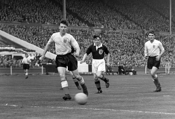 Football - 1954 1955 British Home Championship - England 7 Scotland 2 England s Roger Byrne, left, with teammate Duncan Edwards, far right, at Wembley. Scotland s Lawrie Reilly is centre. 02 04 1955 