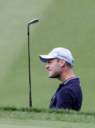 Martin Kaymer reacts after almost chipping in for birdie on the 18th green in the second round of the PGA Golf Herren Championship at Oak Hill Country Club in Rochester, New York on August 9, 2013.  NYP20130809103