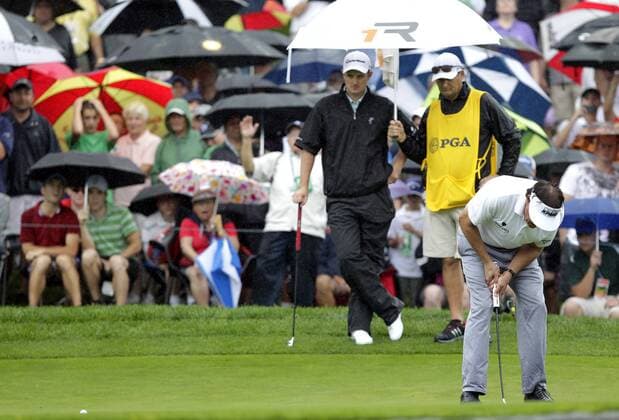 Phil Mickelson reacts when he misses a birdie putt on the 15th hole in the second round of the PGA Golf Herren Championship at Oak Hill Country Club in Rochester, New York on August 9, 2013.  NYP20130809109