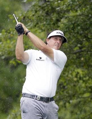 Phil Mickelson hits his tee shot on the 15th hole in the second round of the PGA Golf Herren Championship at Oak Hill Country Club in Rochester, New York on August 9, 2013.  NYP20130809112