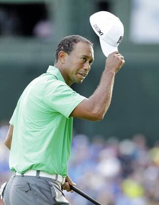 Tiger Woods tips his hat on the 18th green in the second round of the PGA Golf Herren Championship at Oak Hill Country Club in Rochester, New York on August 9, 2013.  NYP20130809153