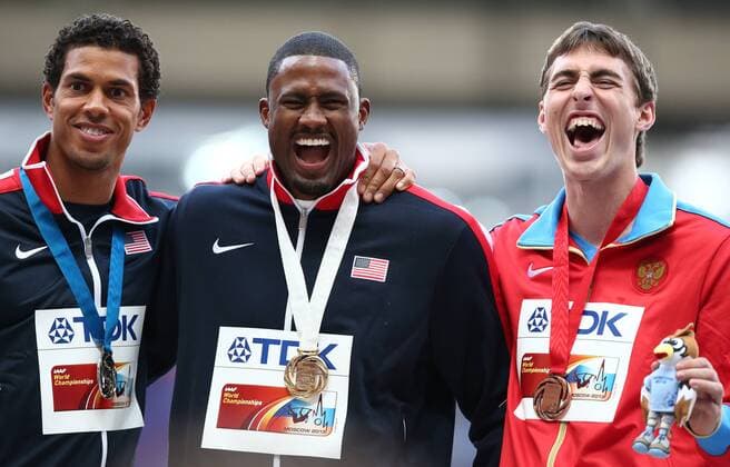 ITAR-TASS: MOSCOW, RUSSIA. AUGUST 13, 2013. US silver medalist Ryan Wilson, gold medalist David Oliver, and Russia s bronze medalist Sergei Shubenkov (L-R) pose at the awarding ceremony for the men s 110m hurdles event at the 14th IAAF World Athletics Championships.  premiumd RE125325