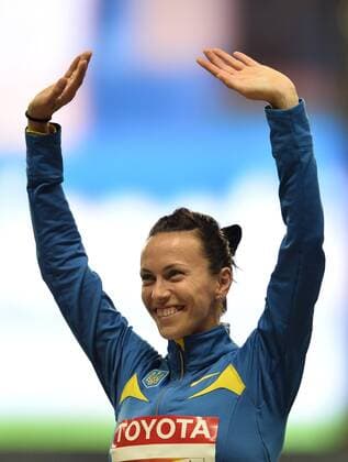 Ganna Melnichenko of Ukraine poses on the podium during the medal ceremony for women s heptathlon on Day 4 of the 14th IAAF World Athletics Championships Moscow 2013 at Luzhniki Stadium in Moscow, Russia on Aug. 13, 2013. (Xinhua Jia Yuchen) (SP)RUSSIA-MOSCOW-ATHLETICS-IAAF WORLD CHAMPIONSHIPS 