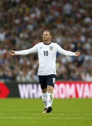 England s Wayne Rooney looks on dejected England v Scotland - International Friendly - Wembley - London - England -14 08 2013 - Pic DavidxKlein Sportimage EDITORIAL USE ONLY. No use with unauthorised audio, video, data, fixture lists, club league logos or live services. Online in-match use limited to 120 images, no video emulation. No use in betting, games or single club league player publications.