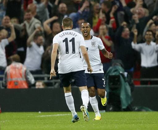 England s Theo Walcott celebrates scoring his sides opening goal England v Scotland - International Friendly - Wembley - London - England -14 08 2013 - Pic DavidxKlein Sportimage EDITORIAL USE ONLY. No use with unauthorised audio, video, data, fixture lists, club league logos or live services. Online in-match use limited to 120 images, no video emulation. No use in betting, games or single club league player publications.
