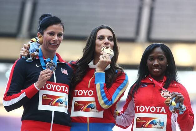 ITAR-TASS: MOSCOW, RUSSIA. AUGUST 15, 2013. Silver medal winner, US athlete Jennifer Suhr, gold medal winner, Russia s Yelena Isinbayeva, and bronze medal winner, Cuba s Yarisley Silva, (L-R) pose during the medal ceremony for the women s pole vault final at Luzhniki on Day 6 of the 14th IAAF World Championships in Athletics.  premiumd RE125718