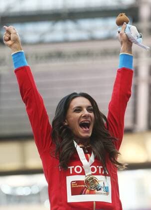 ITAR-TASS: MOSCOW, RUSSIA. AUGUST 15, 2013. Gold medal winner, Russia s Yelena Isinbayeva celebrates during the medal ceremony for the women s pole vault final at Luzhniki on Day 6 of the 14th IAAF World Championships in Athletics.  premiumd RE12571B
