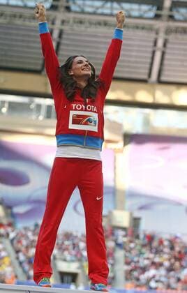 ITAR-TASS: MOSCOW, RUSSIA. AUGUST 15, 2013. Gold medal winner, Russia s Yelena Isinbayeva celebrates during the medal ceremony for the women s pole vault final at Luzhniki on Day 6 of the 14th IAAF World Championships in Athletics.  premiumd RE12571C