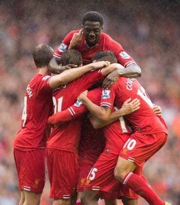 Kolo Toure of Liverpool joins in celebrations of Daniel Sturridge s opening goal - FC Liverpool vs. Stoke City FC - Premier League - Anfield - Liverpool - 17 08 2013 EDITORIAL USE ONLY. No use with unauthorised audio, video, data, fixture lists, club league logos or live services. Online in-match use limited to 120 images, no video emulation. No use in betting, games or single club league player publications.