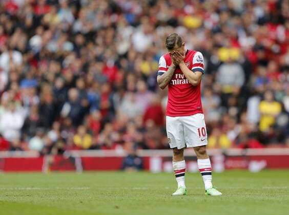 Arsenal s Jack Wilshere looks on dejected after getting booked - FC Arsenal London v Aston Villa FC - Barclays Premiership - Emirates Stadium - London - England -17 08 2013 - EDITORIAL USE ONLY. No use with unauthorised audio, video, data, fixture lists, club league logos or live services. Online in-match use limited to 120 images, no video emulation. No use in betting, games or single club league player publications.