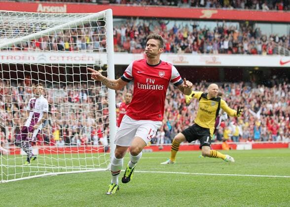 Arsenal s Olivier Giroud celebrates scoring his sides opening goal - FC Arsenal London v Aston Villa FC - Barclays Premiership - Emirates Stadium - London - England -17 08 2013 - EDITORIAL USE ONLY. No use with unauthorised audio, video, data, fixture lists, club league logos or live services. Online in-match use limited to 120 images, no video emulation. No use in betting, games or single club league player publications.