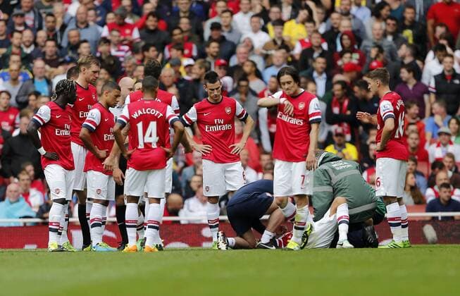 Arsenal s players look on dejected after Kieron Gibbs gets injured - FC Arsenal London v Aston Villa FC - Barclays Premiership - Emirates Stadium - London - England -17 08 2013 - EDITORIAL USE ONLY. No use with unauthorised audio, video, data, fixture lists, club league logos or live services. Online in-match use limited to 120 images, no video emulation. No use in betting, games or single club league player publications.