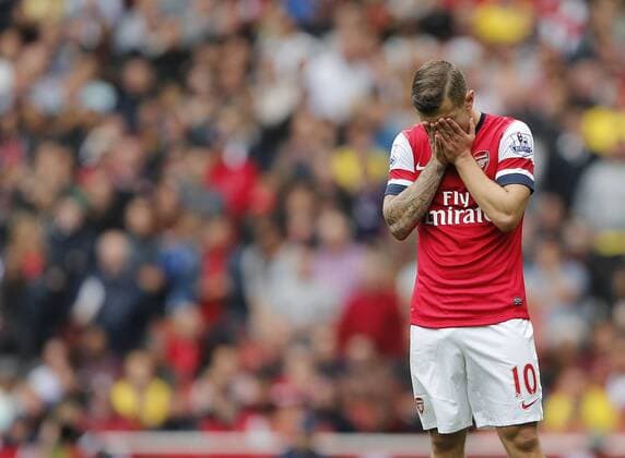 Arsenal s Jack Wilshere looks on dejected - FC Arsenal London vs Aston Villa FC - Barclays Premiership - Emirates Stadium - London - England -17 08 2013 - EDITORIAL USE ONLY. No use with unauthorised audio, video, data, fixture lists, club league logos or live services. Online in-match use limited to 120 images, no video emulation. No use in betting, games or single club league player publications.