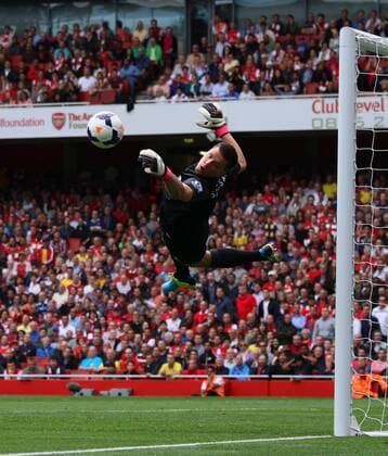 Arsenal FC London v Aston Villa . . London, UK . . 17.08.2013 Wojciech Szczesny(A) pulls off a great save from an Ashley Westwood shot. 