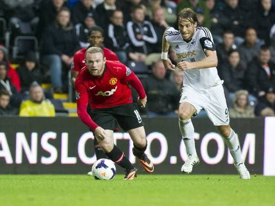 Football - 2013 2014 Premier League - Swansea City vs. Manchester United (ManU) wayne rooney attacks at Liberty Stadium.