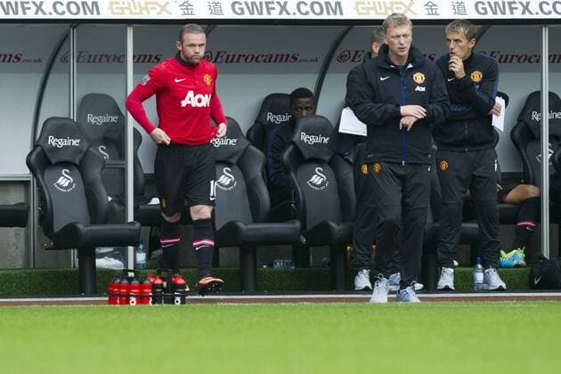 Football - 2013 2014 Premier League - Swansea City vs. Manchester United (ManU) wayne rooney next to david moyestakes the field as sub at Liberty Stadium.