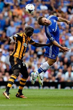 Yannick Sagbo of Hull City and Branislav Ivanovic of Chelsea - Chelsea v Hull City - Premier League - Stamford Bridge - London - 18th August 2013 - Pic Charlie Forgham-Bailey Sportimage EDITORIAL USE ONLY. No use with unauthorised audio, video, data, fixture lists, club league logos or live services. Online in-match use limited to 120 images, no video emulation. No use in betting, games or single club league player publications.
