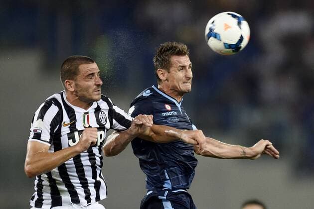 Db Roma 18 08 2013 - Supercoppa Italiana Juventus-Lazio foto Daniele Buffa Image Sport nella foto: Miroslav Klose-Leonardo Bonucci 