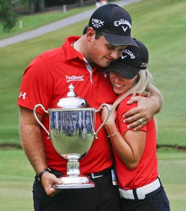 Aug. 18, 2013 - Greensboro, North Carolina, U.S - PATRICK REED and his wife JUSTINE REED hug after receiving the trophy after winning the 2013 Wyndham Championship at Sedgefield Country Club. Golf 2013 - Wyndham Championship  - ZUMAh10