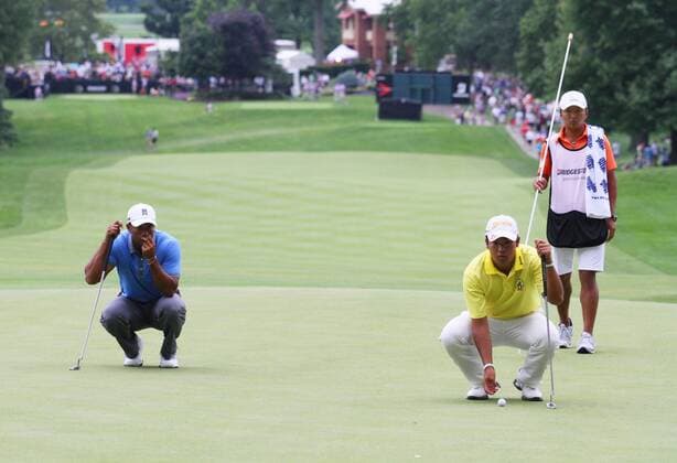 (L-R) Tiger Woods (USA), Hideki Matsuyama (JPN), Daisuke Shindo, AUGUST 2, 2013 - Golf : Tiger Woods of the United States and Hideki Matsuyama of Japan line up a putt during the second round of the WGC-Bridgestone Invitational at the South Course of Firestone Country Club in Akron, Ohio, United States. NoxThirdxPartyxSales  (unia008527)