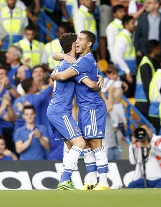 Chelsea s Eden Hazard celebrates his sides opening goal Chelsea v Aston Villa - Barclays Premiership - Stamford Bridge - London - England -21 08 2013 - Pic David Klein Sportimage EDITORIAL USE ONLY. No use with unauthorised audio, video, data, fixture lists, club league logos or live services. Online in-match use limited to 120 images, no video emulation. No use in betting, games or single club league player publications.