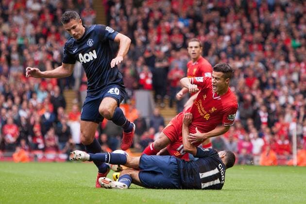 Robin van Persie and Ryan Giggs of Manchester United challenge Philippe Coutinho of Liverpool - Liverpool FC vs. Manchester United (ManU) - Barclay s Premier League - Anfield - Liverpool - 01 09 2013 EDITORIAL USE ONLY. No use with unauthorised audio, video, data, fixture lists, club league logos or live services. Online in-match use limited to 120 images, no video emulation. No use in betting, games or single club league player publications.