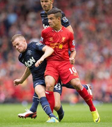 Tom Cleverley of Manchester United earns a yellow card with a challenge on Philippe Coutinho of Liverpool - Liverpool FC vs. Manchester United (ManU) - Barclay s Premier League - Anfield - Liverpool - 01 09 2013 EDITORIAL USE ONLY. No use with unauthorised audio, video, data, fixture lists, club league logos or live services. Online in-match use limited to 120 images, no video emulation. No use in betting, games or single club league player publications.