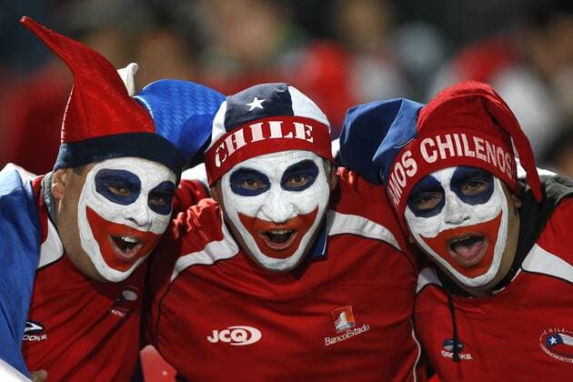 Football, Chile. World Cup Brazil 2014, qualifying match. The chilean national team fans cheer their team prior to the World Cup Brazil 2014 qualifying football match held at National stadium in Santiago, Chile 