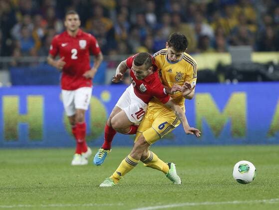 Ukraine s Taras Stepanenko tussles with England s Jack Wilshere Ukraine v England - 2014 World Cup Qualifier - Olympic Stadium - Kiev - Ukraine -10 09 2013 - Pic David Klein Sportimage EDITORIAL USE ONLY. No use with unauthorised audio, video, data, fixture lists, club league logos or live services. Online in-match use limited to 120 images, no video emulation. No use in betting, games or single club league player publications.