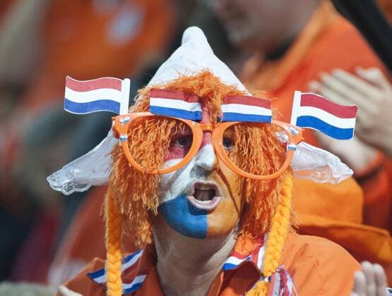 (130910) -- ANDORRA, Sept. 10, 2013 (Xinhua) -- A supporter of Netherlands cheers during the 2014 World Cup Qualifiers match Sept. 10, 2013. (Xinhua Xie Haining) -SOCCER-NETHERLANDS-QUALIFIED 