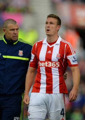 Robert Huth of Stoke City feels the effects of being knocked out - Barclays Premier League - Stoke City vs Manchester City - Britannia Stadium - Stoke on Trent - 14 09 13 - Picture Simon Bellis Sportimage EDITORIAL USE ONLY. No use with unauthorised audio, video, data, fixture lists, club league logos or live services. Online in-match use limited to 120 images, no video emulation. No use in betting, games or single club league player publications.
