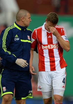 Robert Huth of Stoke City feels the effects of being knocked out - Barclays Premier League - Stoke City vs Manchester City - Britannia Stadium - Stoke on Trent - 14 09 13 - Picture Simon Bellis Sportimage EDITORIAL USE ONLY. No use with unauthorised audio, video, data, fixture lists, club league logos or live services. Online in-match use limited to 120 images, no video emulation. No use in betting, games or single club league player publications.