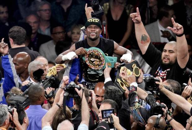 September 14, 2013 - Las Vegas, Nevada, U.S. - American boxer FLOYD MAYWEATHER JR. with the belts after majority decision in the junior middleweight title WBA WBC unification fight at the MGM Grand in Las Vegas on Saturday night. Boxing 2013 -  - ZUMAu78