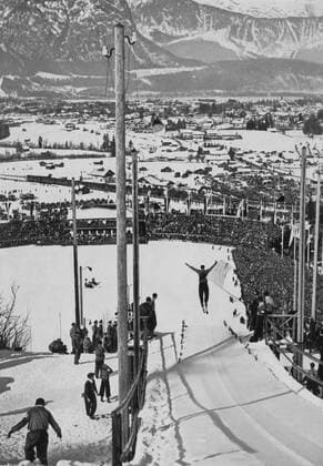 A view of the snow-covered Garmisch-Partenkirchen and the sixty thousand in the ski stadium watching a jump in the combination long run jump. Â  UnitedArchives00797849